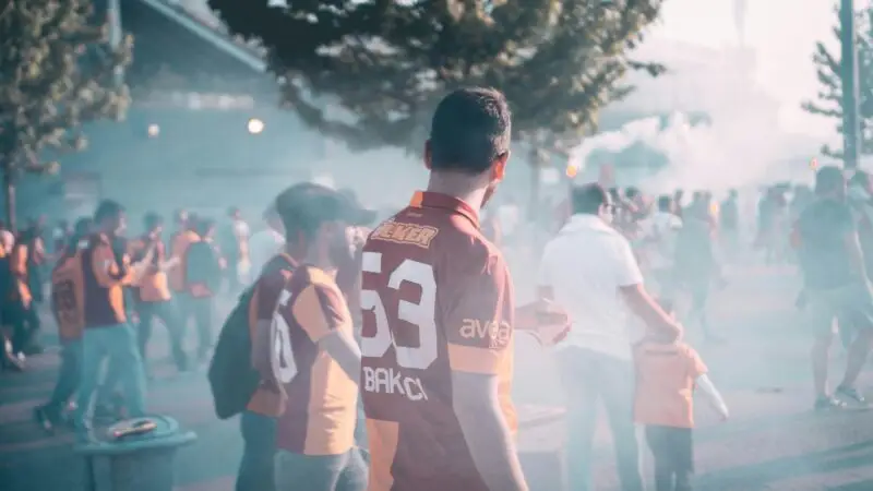Crowd of enthusiastic football fans gathering outside a stadium in İstanbul, Türkiye.